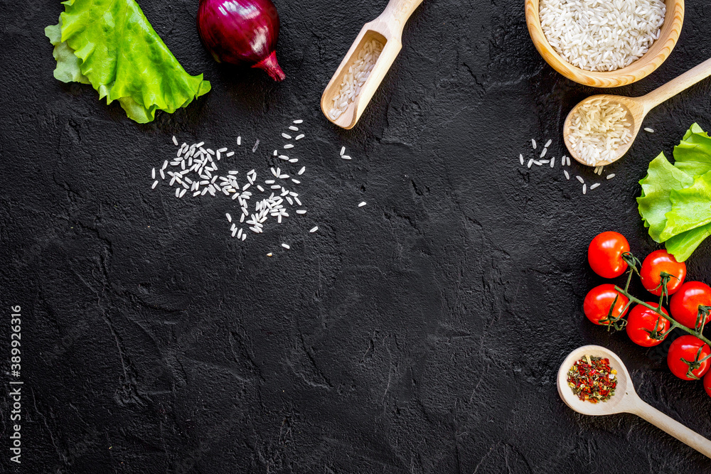 ingredients for paella on dark background top view