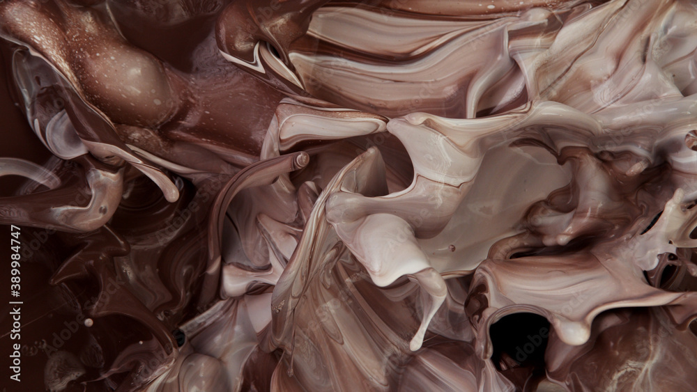 Closeup of splashing hot chocolate with milk