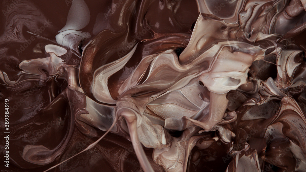 Closeup of splashing hot chocolate with milk