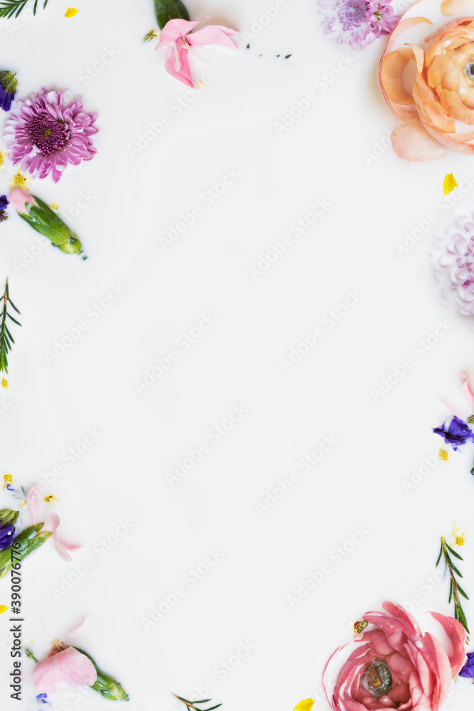 Colorful buttercup flowers in a milk bath