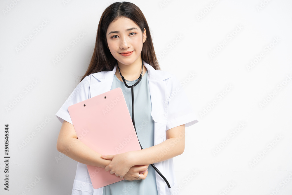 Portrait of female doctor holding document in hand
