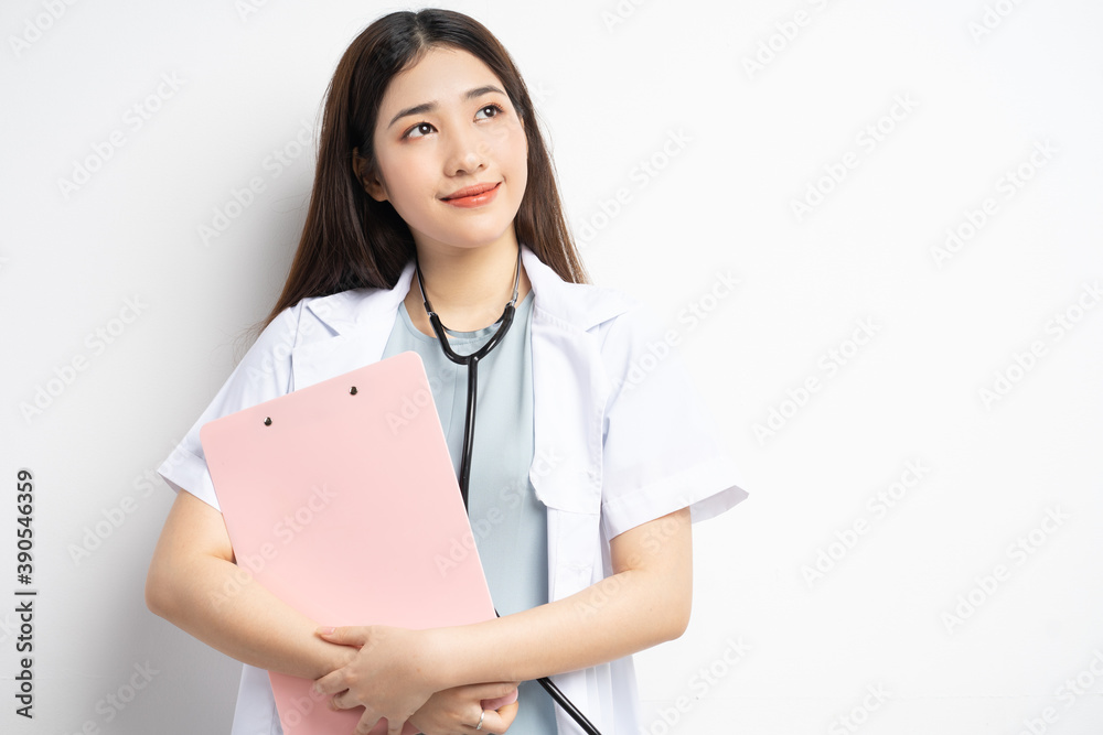 Portrait of female doctor holding document in hand
