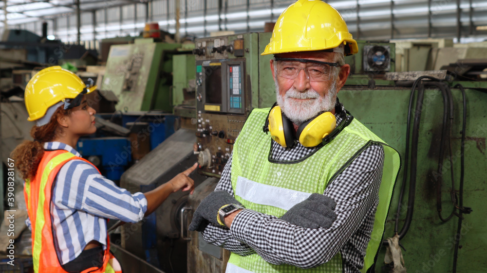 Senior factory worker or engineer close up portrait in factory . Industry and engineering concept .