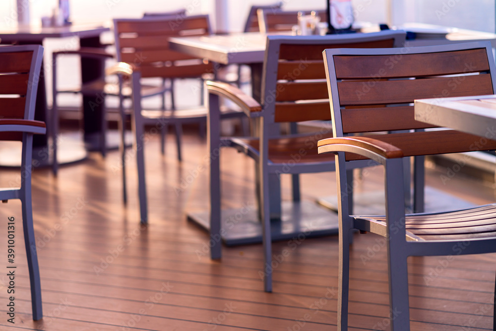 dining table and wooden chair on wooden cruise deck with nobody sunset time