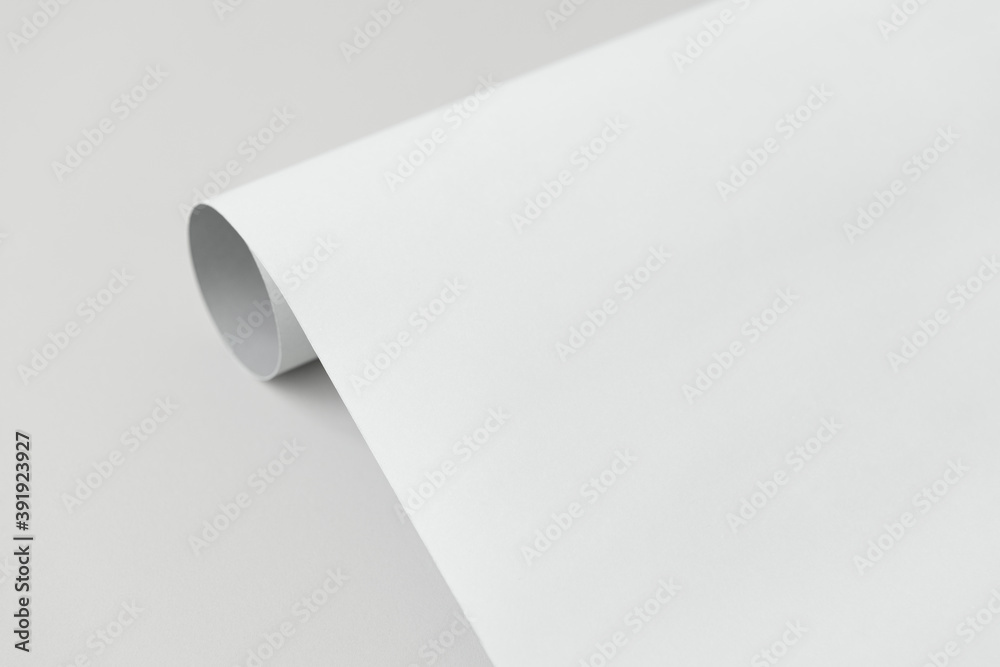 Gray and white rolled paper on a gray background