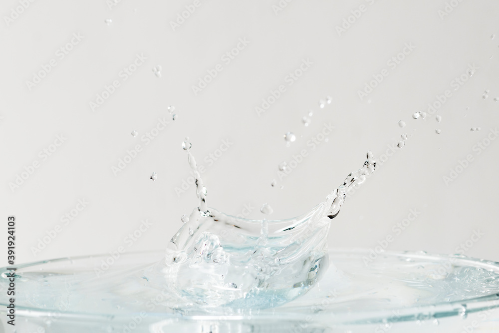 Water splash on top of the glass background wallpaper