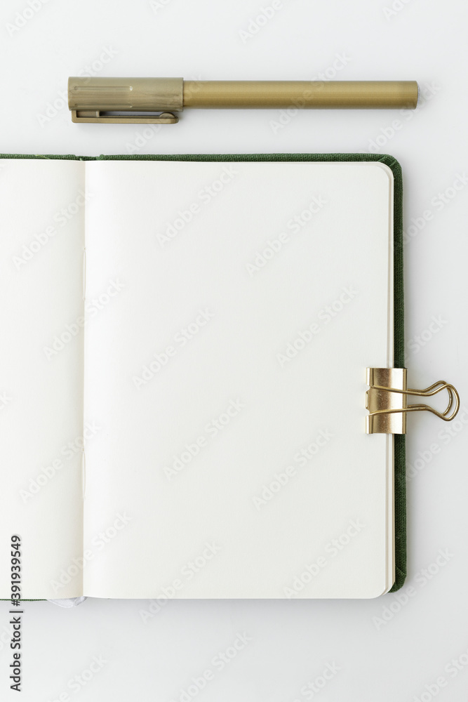 Blank plain white notebook page with stationary