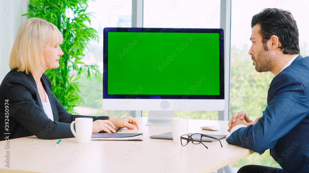 Business people in the conference room with green screen chroma key TV or computer on the office tab