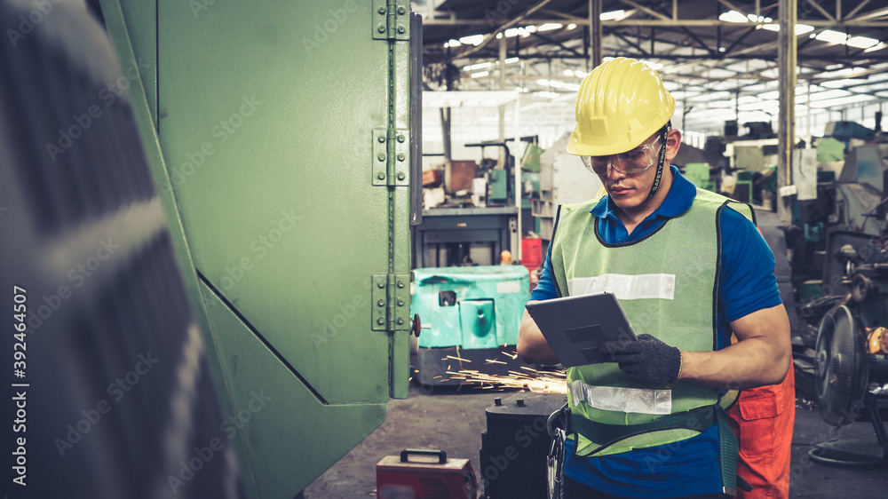 Smart factory worker using machine in factory workshop . Industry and engineering concept.