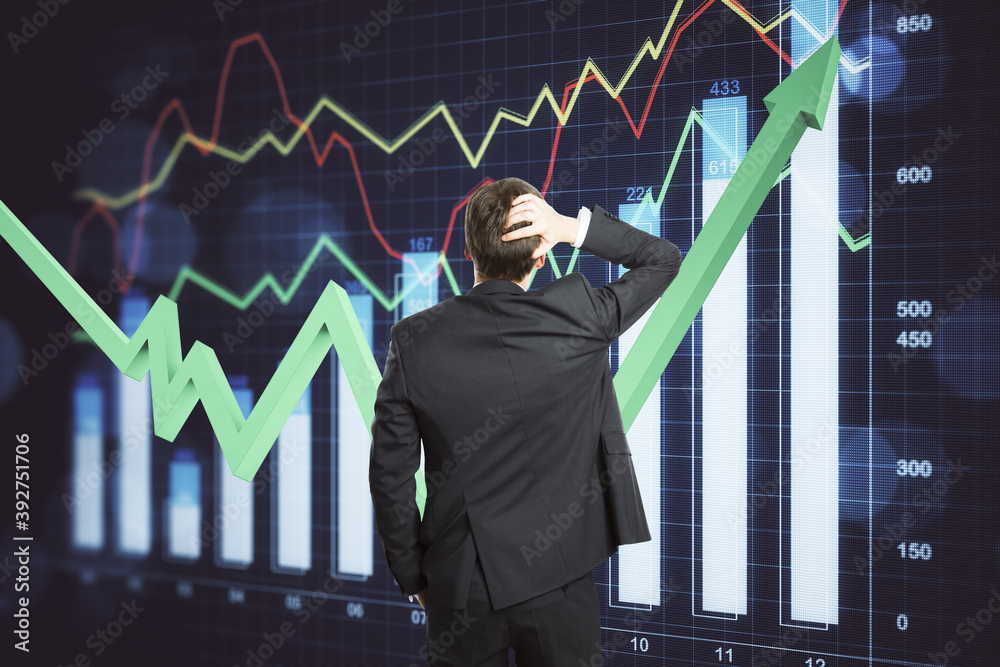 Businessman looking on business report interface on virtual screen.