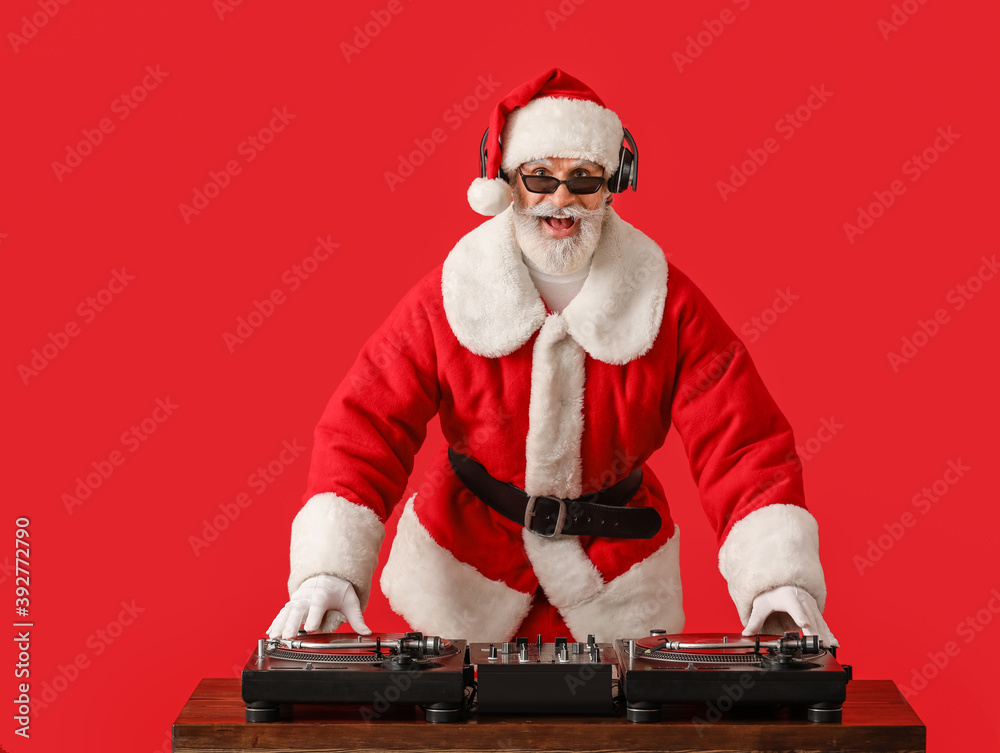 Cool Santa DJ playing music on color background