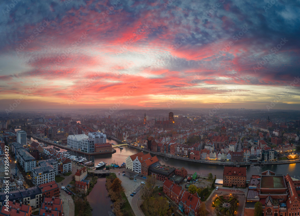 Amazing light show at sunset over Gdansk city in Poland