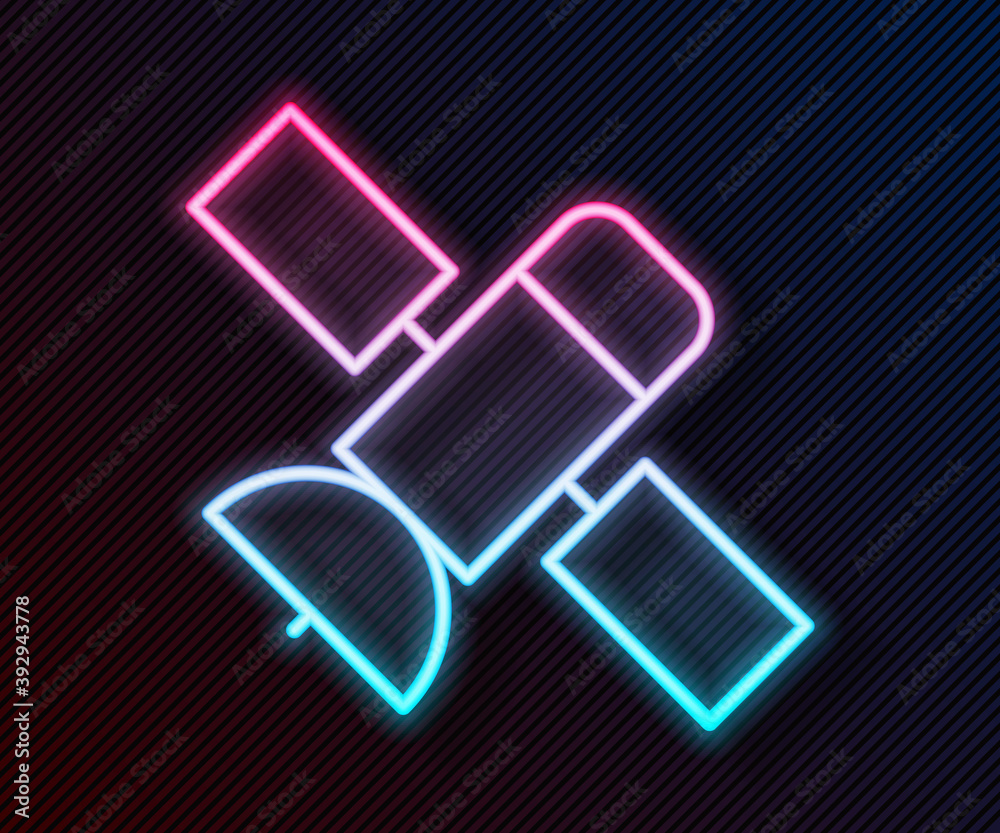 Glowing neon line Satellite icon isolated on black background. Vector.