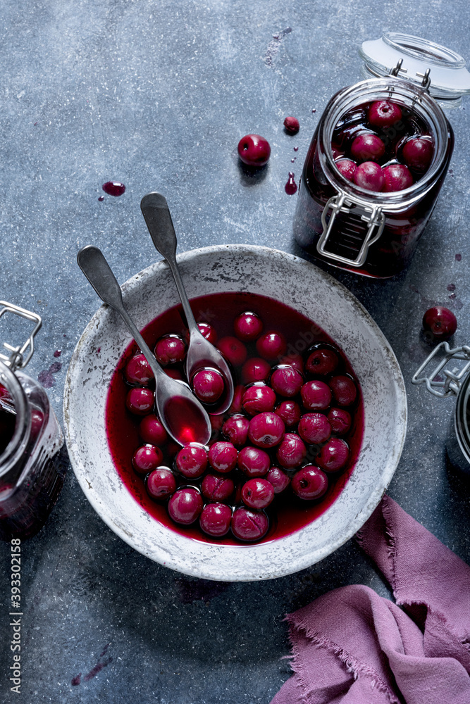 Maraschino cherry in a bowl and glass jar flat lay food photography