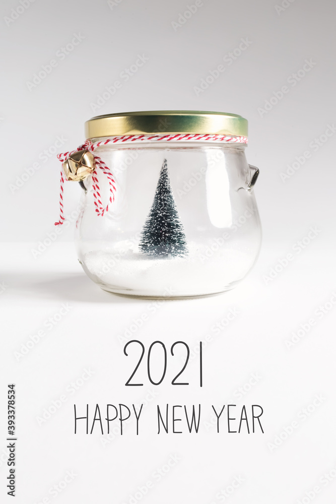 2021 Happy New Year message with Christmas tree in a glass Jar