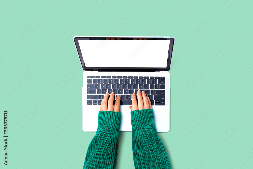 Person using a laptop computer from above