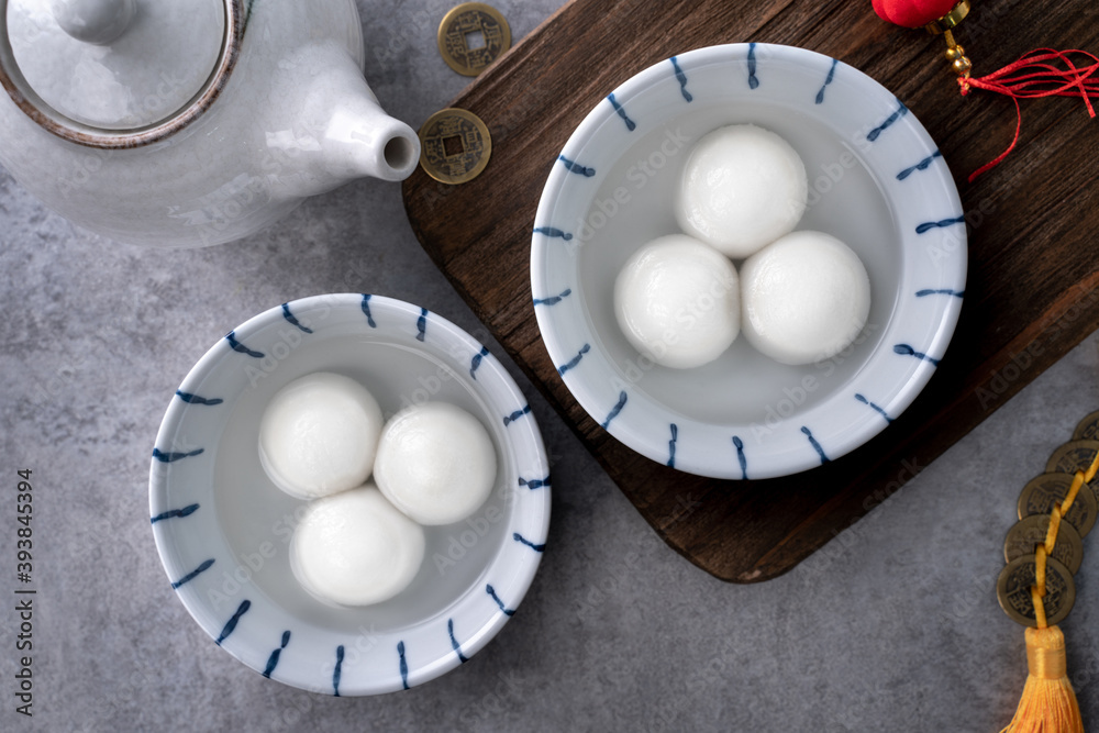 Top view of big tangyuan yuanxiao in a bowl on gray background for lunar new year food.