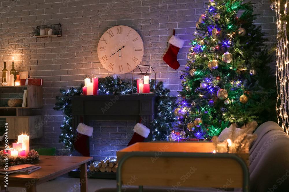 Interior of living room with fireplace decorated for Christmas