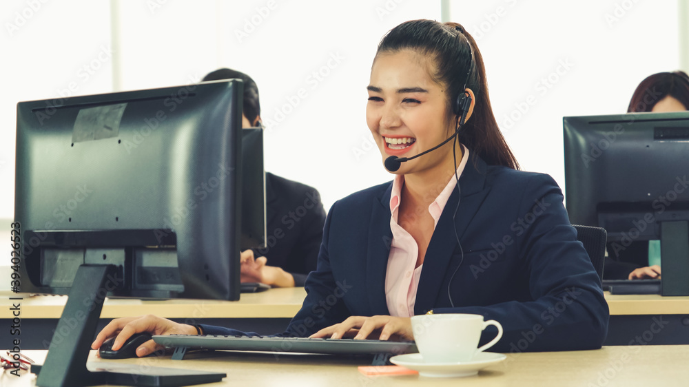 Business people wearing headset working in office to support remote customer or colleague. Call cent