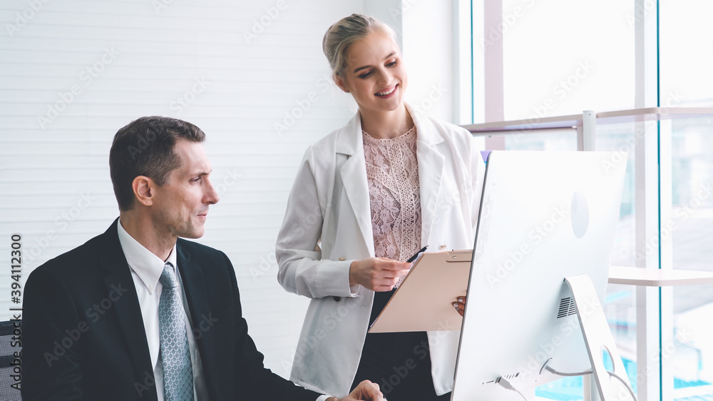 Two business people talk project strategy at office meeting room. Businessman discuss project planni