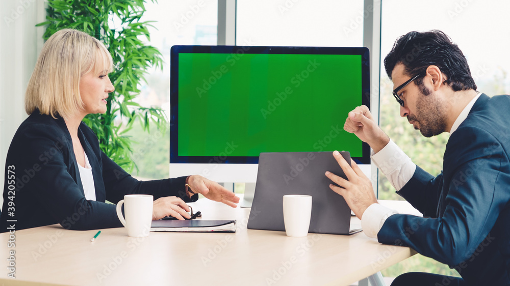 Business people in the conference room with green screen chroma key TV or computer on the office tab