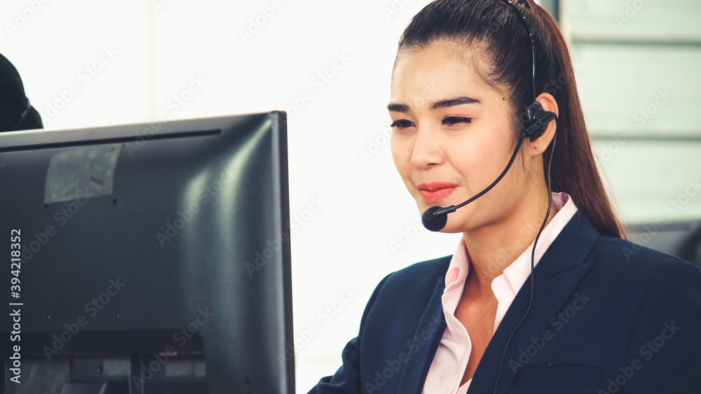 Business people wearing headset working in office to support remote customer or colleague. Call cent