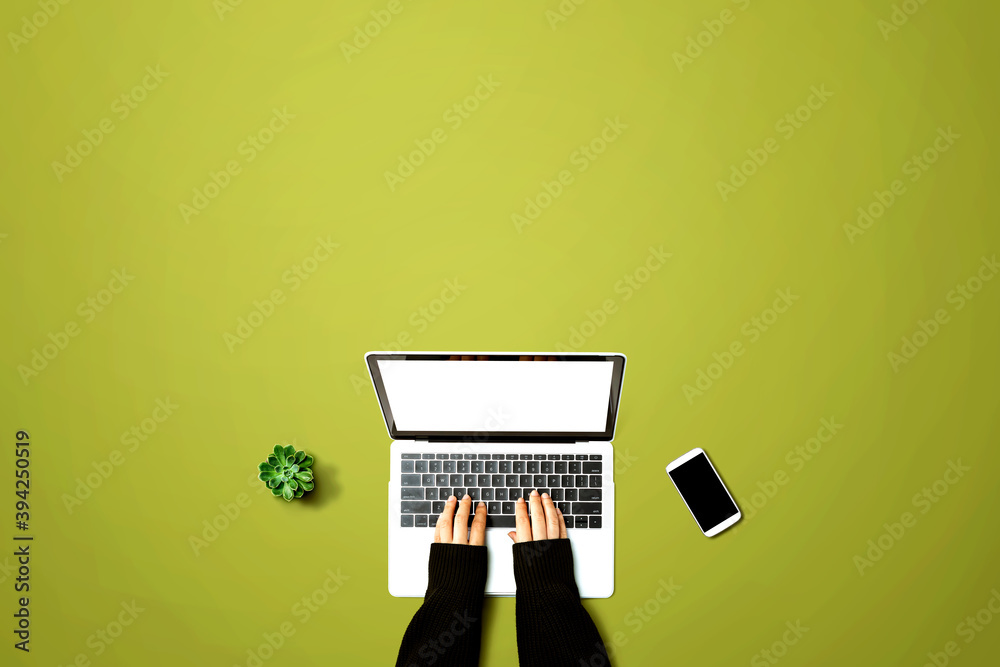 Person using a laptop computer from above