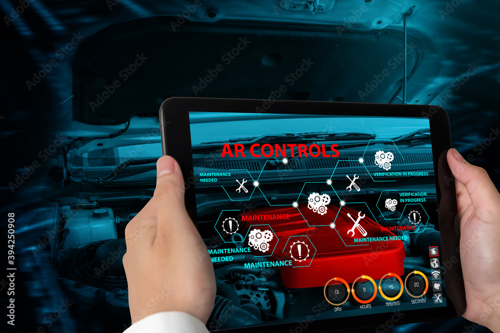 Engineer use augmented reality software to monitor parts of car vehicle with automated application .