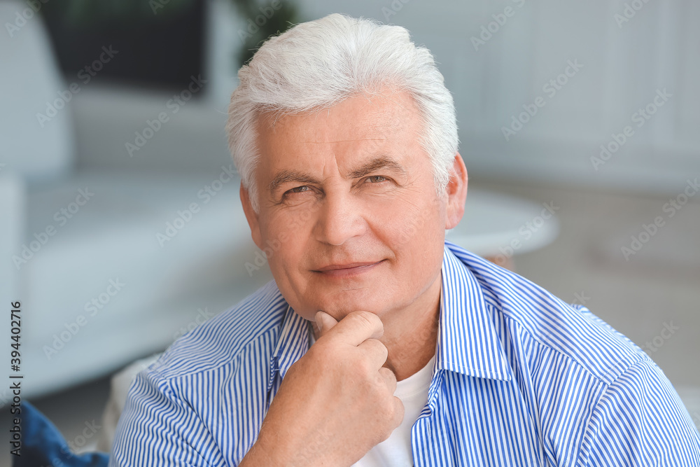 Portrait of senior man resting at home