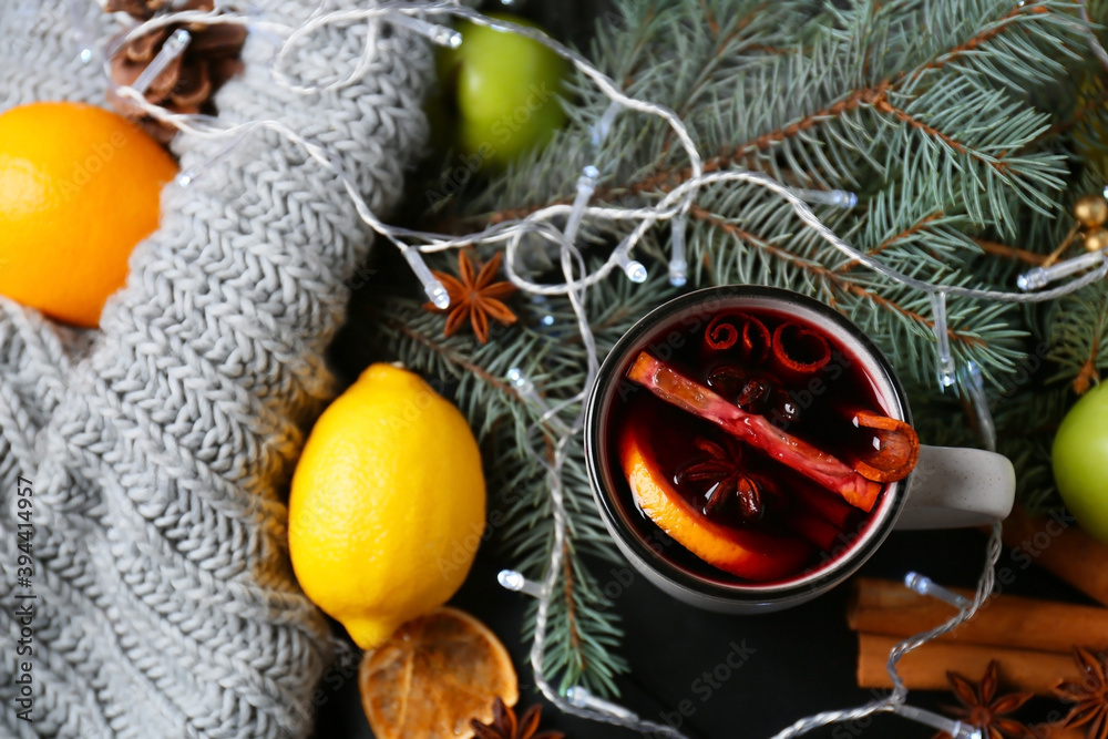 Cup of tasty mulled wine on table