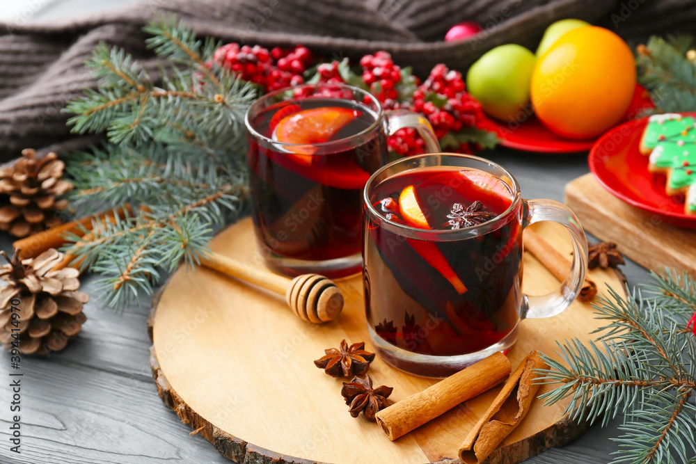 Glass cups of tasty mulled wine on table