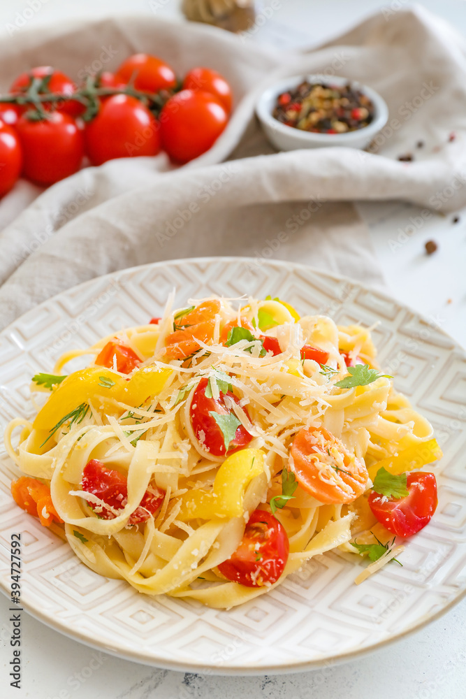 Plate with tasty pasta primavera on table