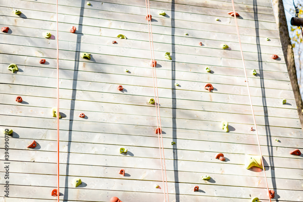 Artificial climbing wall at amusement park outdoors