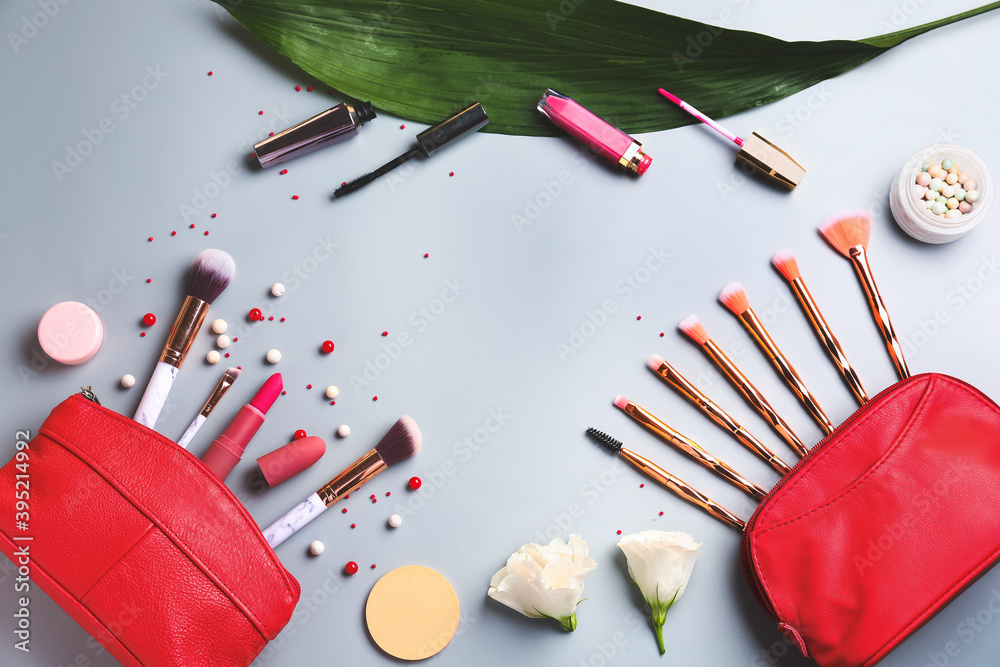 Set of decorative cosmetics and accessories on light background