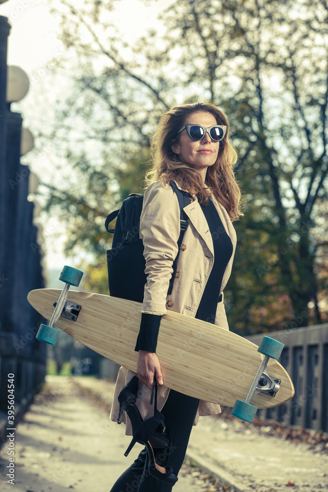 Active woman with longboard.