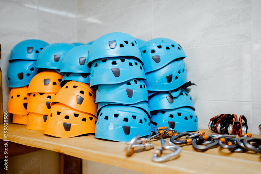 Hardhats and other safety equipment on the shelves at amusement park warehouse