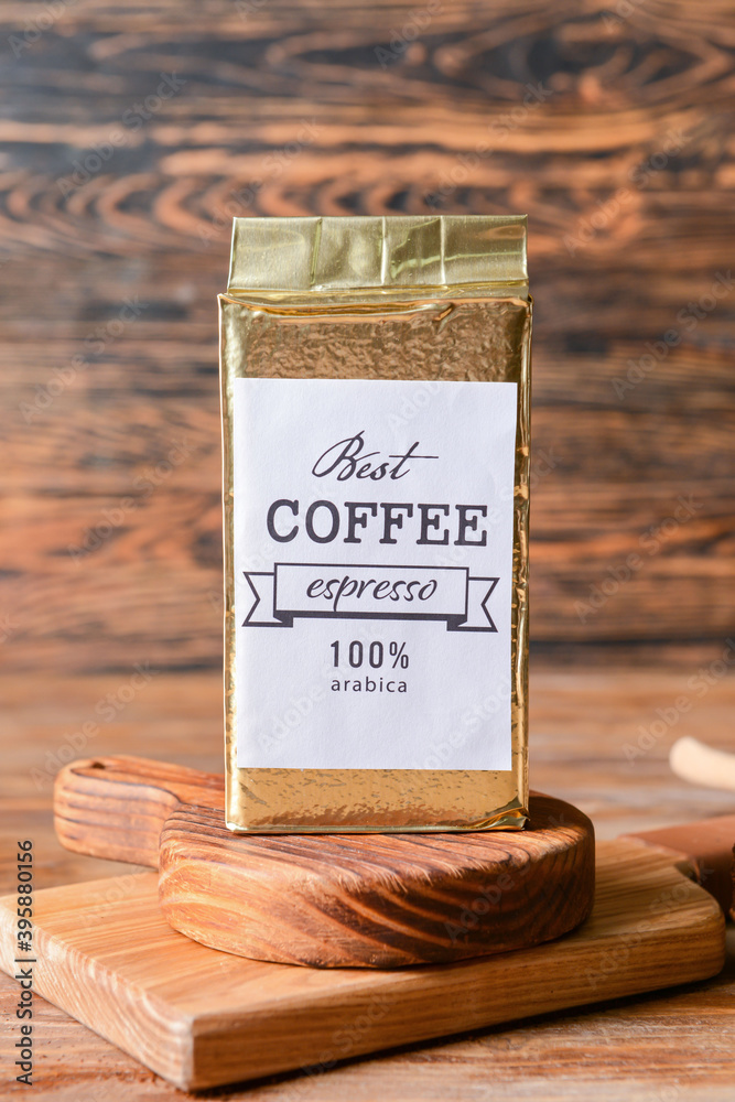 Pack with coffee on wooden background