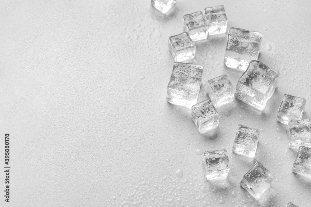 Ice cubes on light background