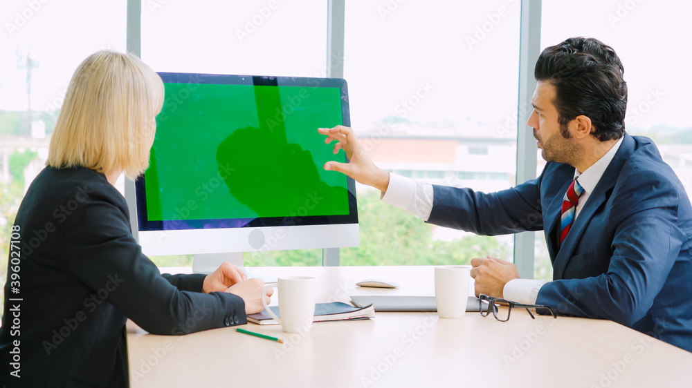 Business people in the conference room with green screen chroma key TV or computer on the office tab