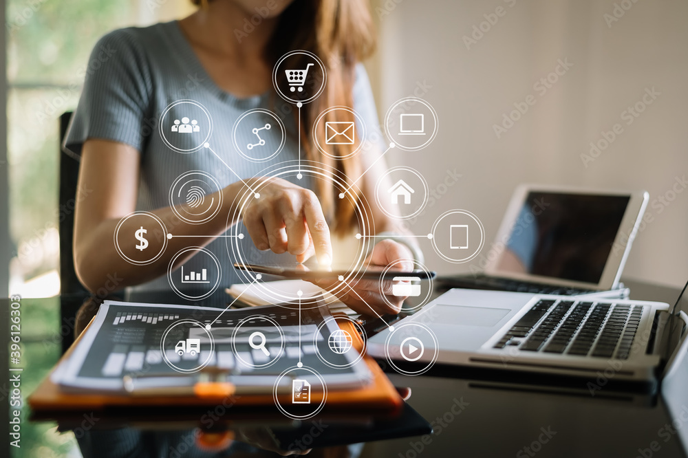  Businessman working with smart phone and laptop and digital tablet computer in  office with digital