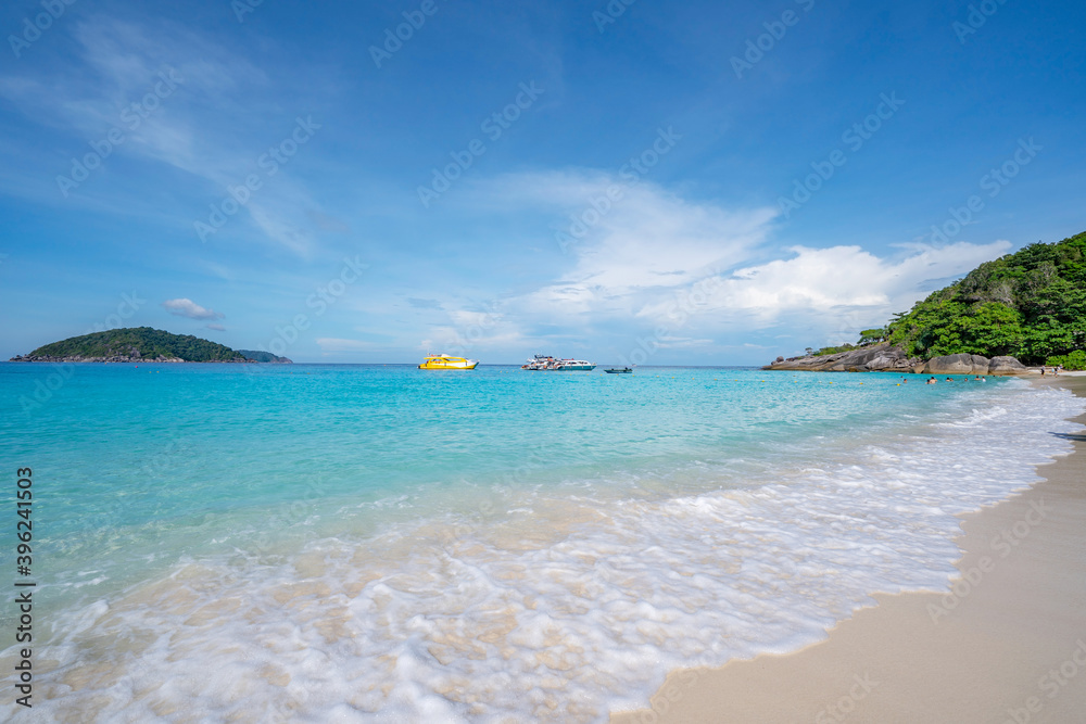 Beautiful sandy beach with wave crashing on sandy shore at Similan Islands Beautiful tropical sea Si