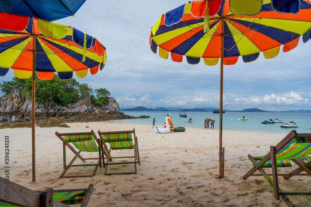 Beach chairs and colorful summer umbrella on Tropical sea white sand Beautiful beach in summer seaso