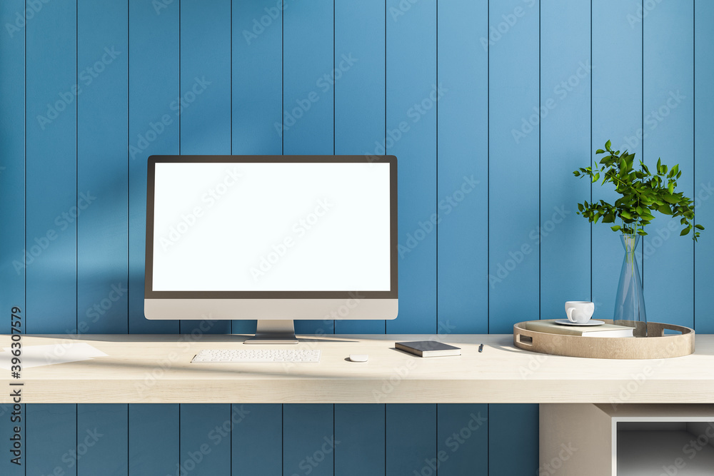 Creative designer table with blank computer screen