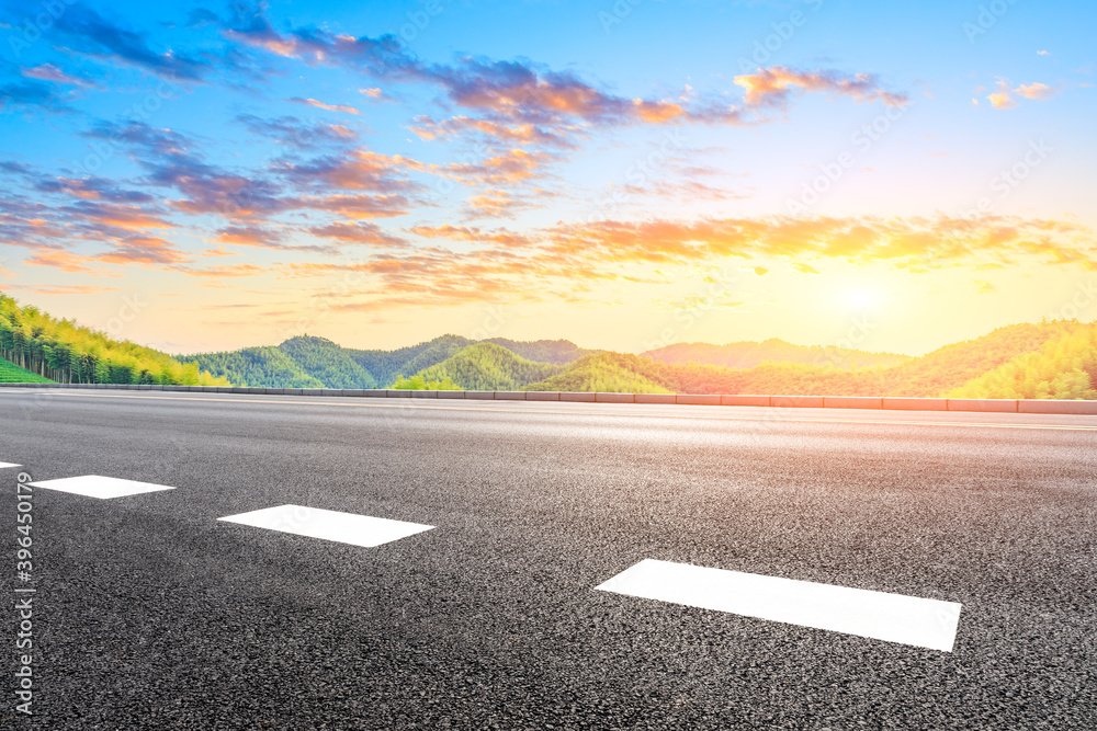 Country asphalt road and green tea plantation with bamboo forest natural landscape.