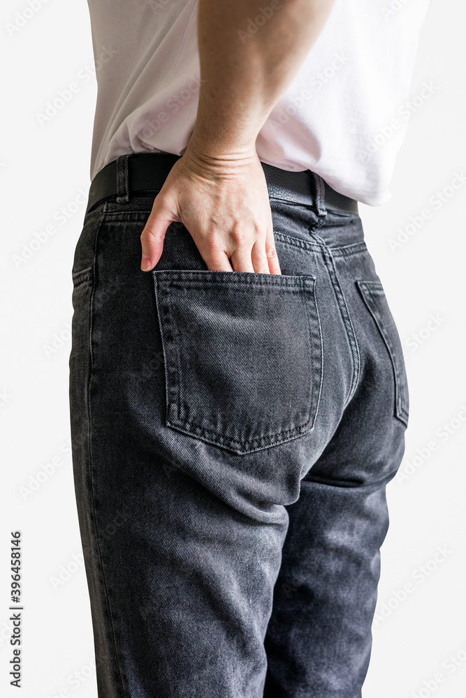 Woman in black jeans from behind