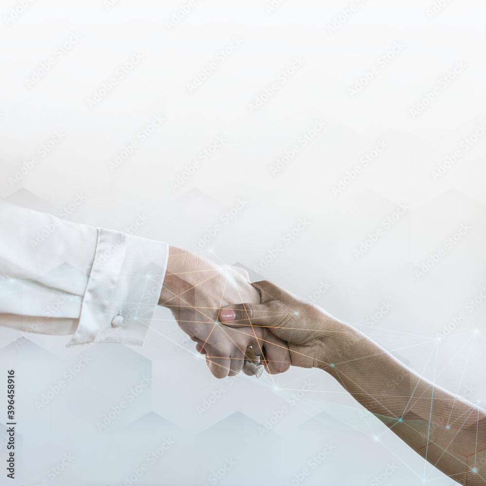 People shaking hands in business agreement background