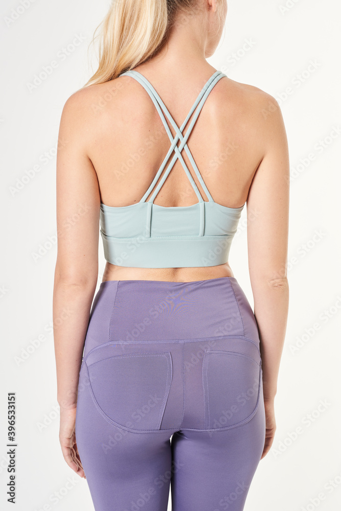 Blonde woman wearing a sports bra mockup with criss cross strap