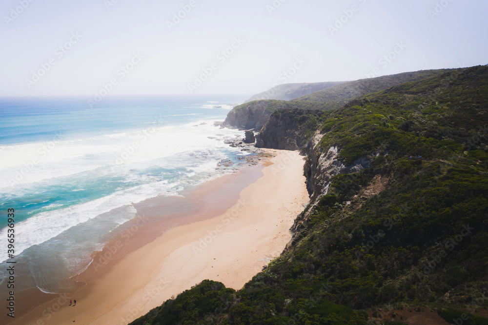 Drone view of coastline under a pastel sky