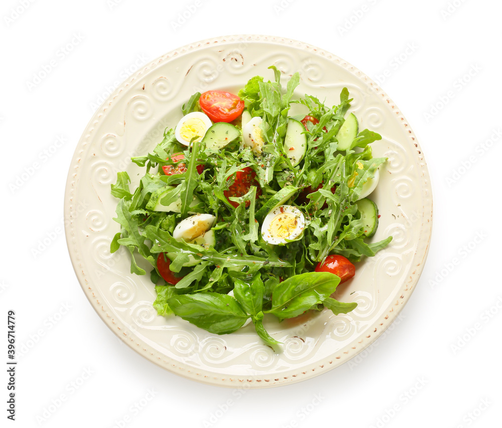 Plate with tasty arugula salad on white background