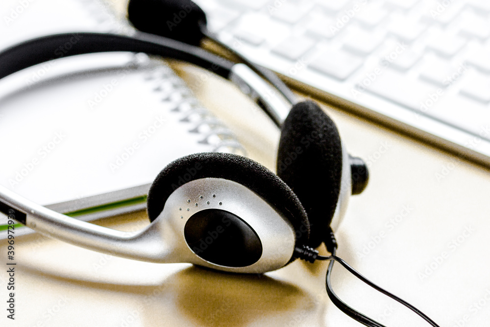 headset and keyboard on workdesk for call center concept